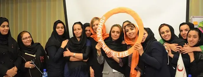 Youth volunteers in Iran show their selfies to promote role of young people